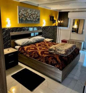 a bedroom with a large bed in a room at Cute Penthouse in Marsaskala