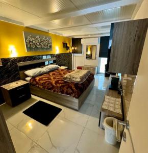 a bedroom with a large bed in a room at Cute Penthouse in Marsaskala