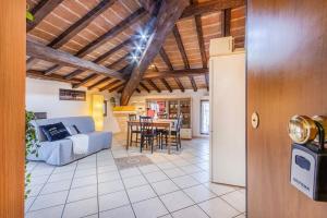 a living room with a couch and a table at Ferrari Museum & Train Station - Il Cavallino Loft in Modena