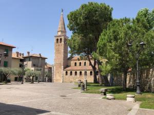 a building with a tall tower with a street light at Savorgnan 1593 in Palmanova