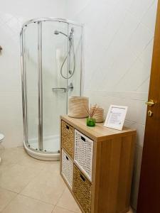 a bathroom with a shower and a stand up shower at Macadà in Bari