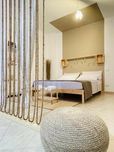 a bedroom with a swinging bed and a largeokedokedokedokedoked at Macadà in Bari