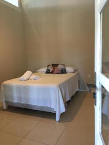 Łóżko lub łóżka w pokoju w obiekcie Pousada Caminhos Do Mar