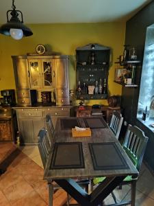 a dining room with a table and chairs at LAZARÓWKA - RYBNO in Rybno