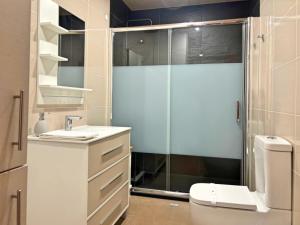 a bathroom with a shower and a toilet and a sink at Retiro de Gondramaz - All house 200 m2 in Gondramaz +26 photos