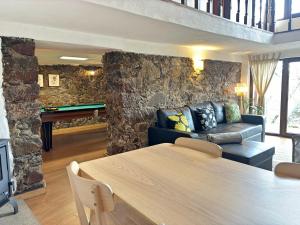 a living room with a couch and a table at Retiro de Gondramaz - All house 200 m2 in Gondramaz