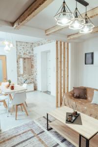 a living room with a couch and a table at luxury house in Ierápetra