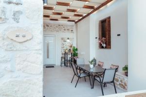 a dining room with a table and chairs at luxury house in Ierapetra