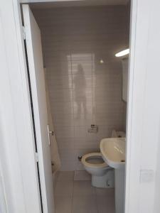 a small bathroom with a toilet and a sink at casa santa susanna Paula Aroa in Santa Susanna