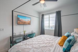 a bedroom with a large bed and a window at Minutes from Kierland King Bed Lux Pool with View S433 in Scottsdale