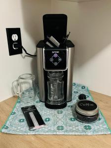 a coffee maker sitting on top of a table at Comfy Home in Trail