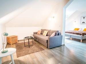 a living room with a couch and a bed at Appartement Chamonix-Mont-Blanc, 4 pièces, 10 personnes - FR-1-517-37 in Chamonix
