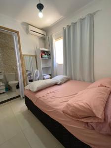 Llit o llits en una habitació de Chácara Amarela - Espaço Duarte