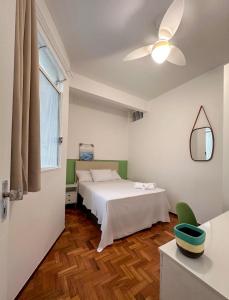 Tempat tidur dalam kamar di Apartamento no coração de Belo Horizonte [2]