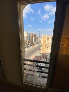 a window with a view of a city street at العاصمة الإدارية in Cairo