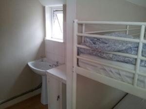 Ένα ή περισσότερα κρεβάτια σε δωμάτιο στο Compton Guest House