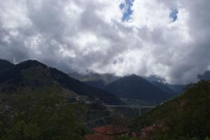 a view of a valley with mountains and a bridge at Αρχοντικό Ειρήνη - 6 Metsovo in Metsovo