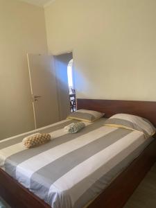 Cama ou camas em um quarto em Baía Villa