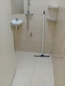 a bathroom with a shower and a sink at Villa Nickerie/ Suriname in Nieuw Nickerie