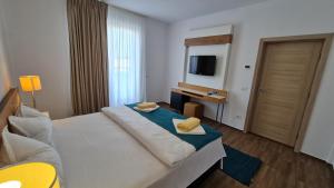 Ένα ή περισσότερα κρεβάτια σε δωμάτιο στο Jafar Resort 10 Penthouse