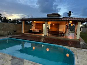 a swimming pool in front of a house at Casa São Miguel dos Milagres in São Miguel dos Milagres
