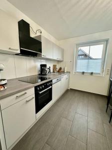 Foto dalla galleria di Stilvoll eingerichtetes Ferienhaus in ruhiger Lage a Bremerhaven Altre 12 foto