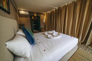 Postel nebo postele na pokoji v ubytování Hotel & Riad Veridis