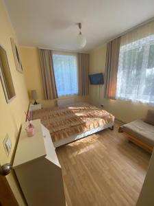 Postel nebo postele na pokoji v ubytování Home Jurmala
