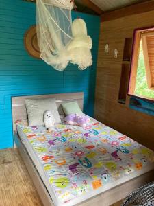 Voodi või voodid majutusasutuse La pirogue enchantée maison karukera toas +28 fotot