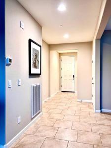 a hallway with a tile floor in a house at Upscale Fully Furnished Resort Home-Gated Golf Community in Rio Verde