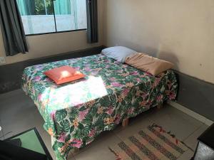 Ένα ή περισσότερα κρεβάτια σε δωμάτιο στο Pousada Chácara Família H