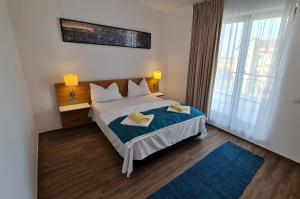 Postel nebo postele na pokoji v ubytování Jafar Resort 9 Penthouse