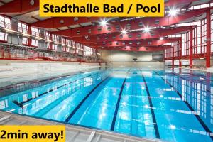 a large swimming pool with the words stabilize bad at Vienna Shopping Center 8 Appartment in Vienna