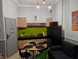 a kitchen with a table and chairs in a room at Górnośląska 19 in Zawiercie