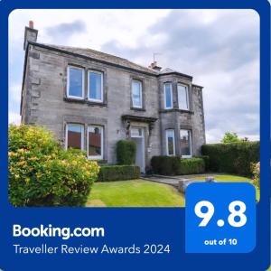 a house with a sign that says travel review awards at Immanuel House - Modern Victorian Home 1872 - Free Parking & Fast Fibre Optic WiFi in Edinburgh
