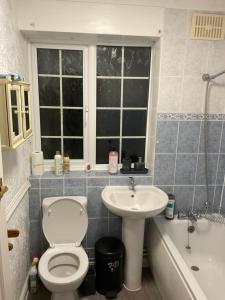 a bathroom with a toilet and a sink at MAYE HOUSE 