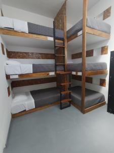 a rendering of a dorm room with bunk beds at SGH Paracas Hospedaje in Paracas