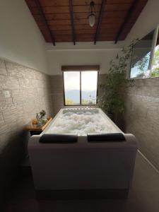 Postel nebo postele na pokoji v ubytování Hapu Tales - Private Holiday Villa