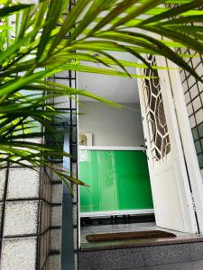 an open door with a plant in front of it at Center Hostel Sp in Sao Paulo
