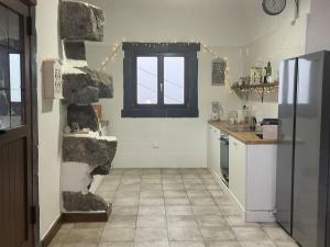 a kitchen with a sink in the middle of a room at Escape to the country - Casa de Lorenzo, El Hierro in San Andrés