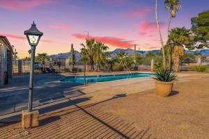 a street light next to a swimming pool at Charming dog-friendly, 2BR-1BA with Pool, Mountain Views - Low Summer Rates! in Tucson