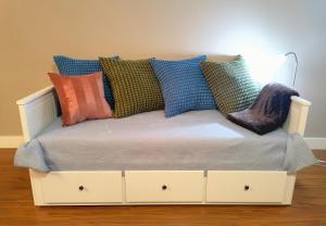 a bed with pillows on top of it at JESI'S NEW HOUSE, Self Enter 2BR, Whole Suite, Close to White Rock Beach & US Border in Surrey +25 photos