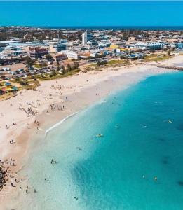 an aerial view of a beach with people in the water at Mariner Resort Comfort - unit 165 in Geraldton