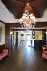 a large room with a ceiling with a chandelier at SAMIR Stay at NW Expressway in Oklahoma City