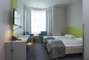 Postel nebo postele na pokoji v ubytování Thon Hotel Trondheim
