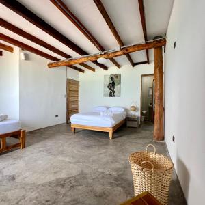 Postel nebo postele na pokoji v ubytování Cabañas W Beach