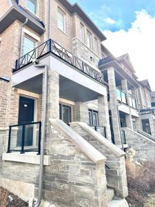 a building with a staircase in front of it at Golden Beautiful Home in Brampton