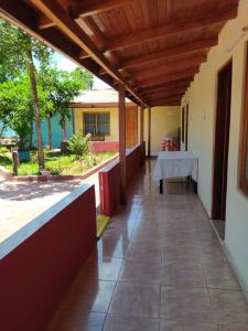 a view from the outside of a house with a table at peixes apart in Puerto Iguazú