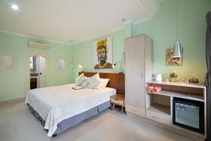 Ένα ή περισσότερα κρεβάτια σε δωμάτιο στο Angel House Ubud Eco Villa