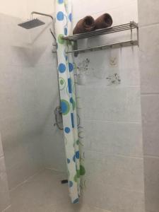 a shower curtain in a bathroom with at Duang Champa 2 Guest house in Luang Prabang